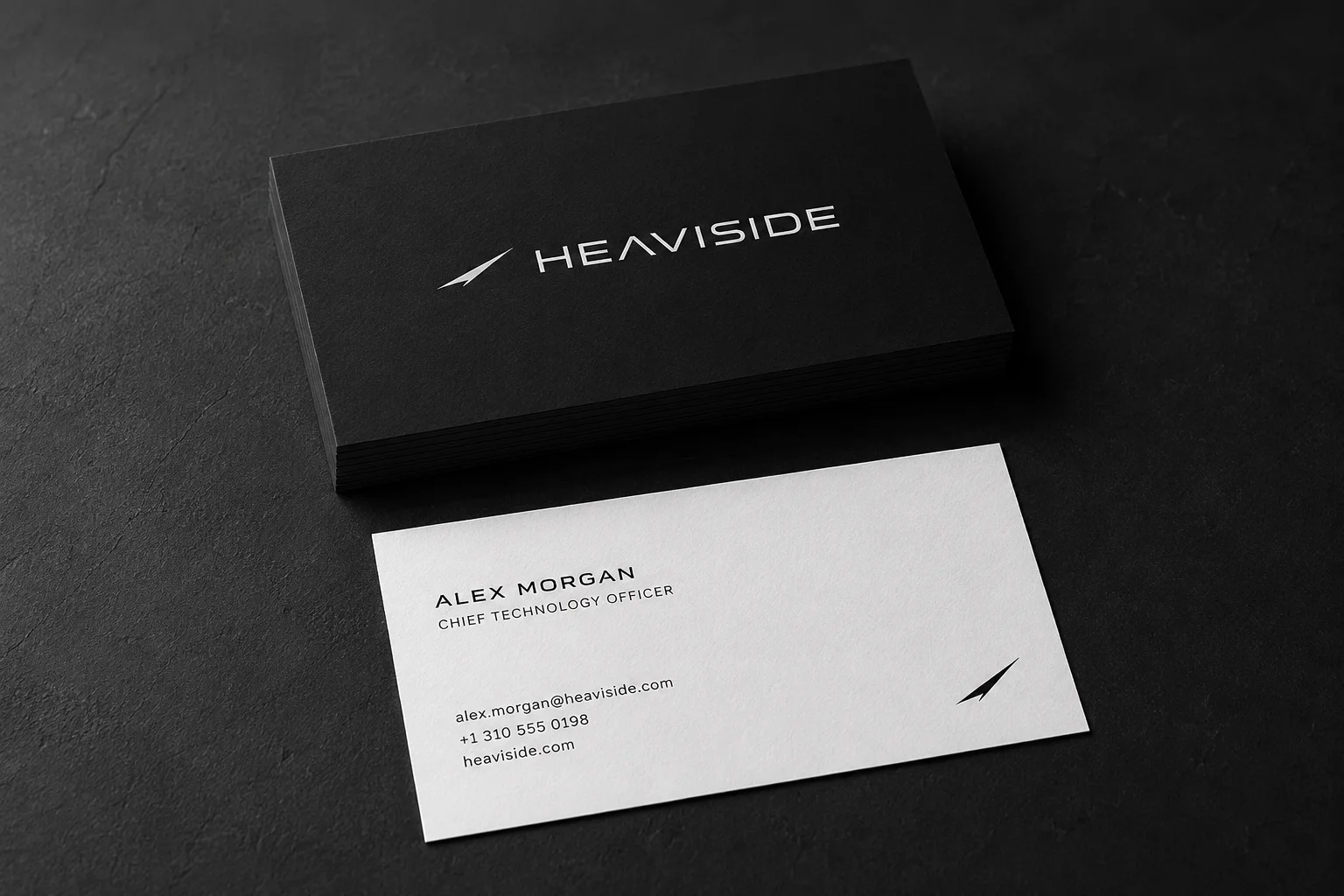 Black and white business cards with the wordmark and vapor-trail mark