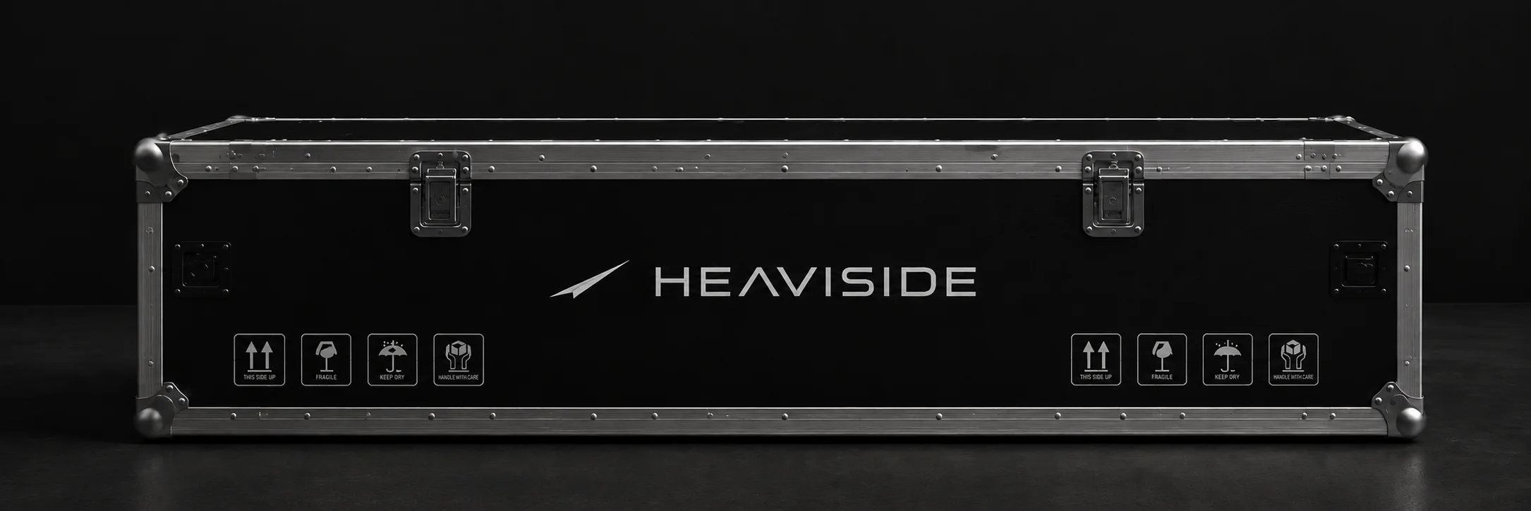 A road flight case stenciled with the wordmark and handling icons