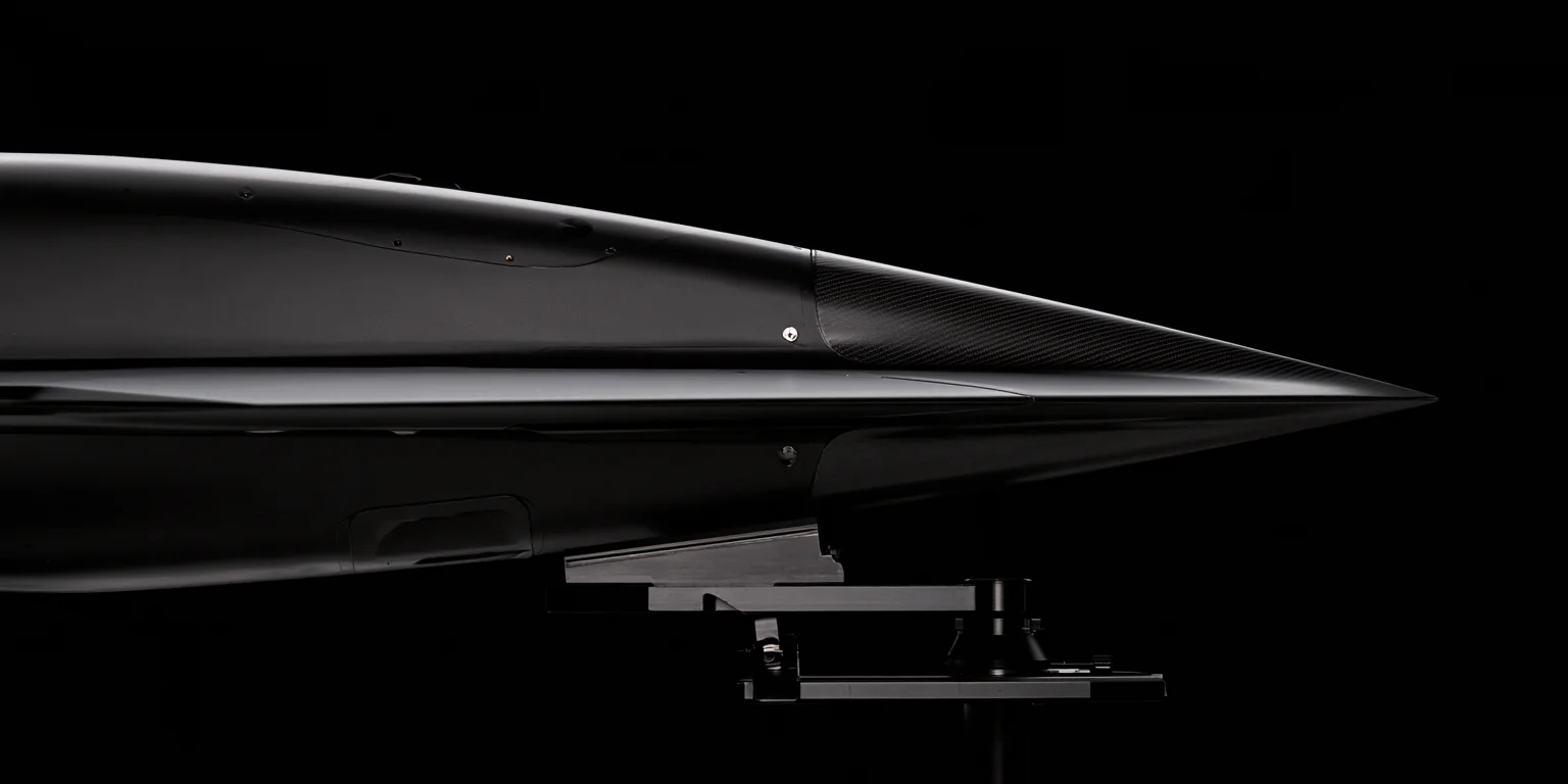 A close crop of a vehicle nose cone in near-darkness